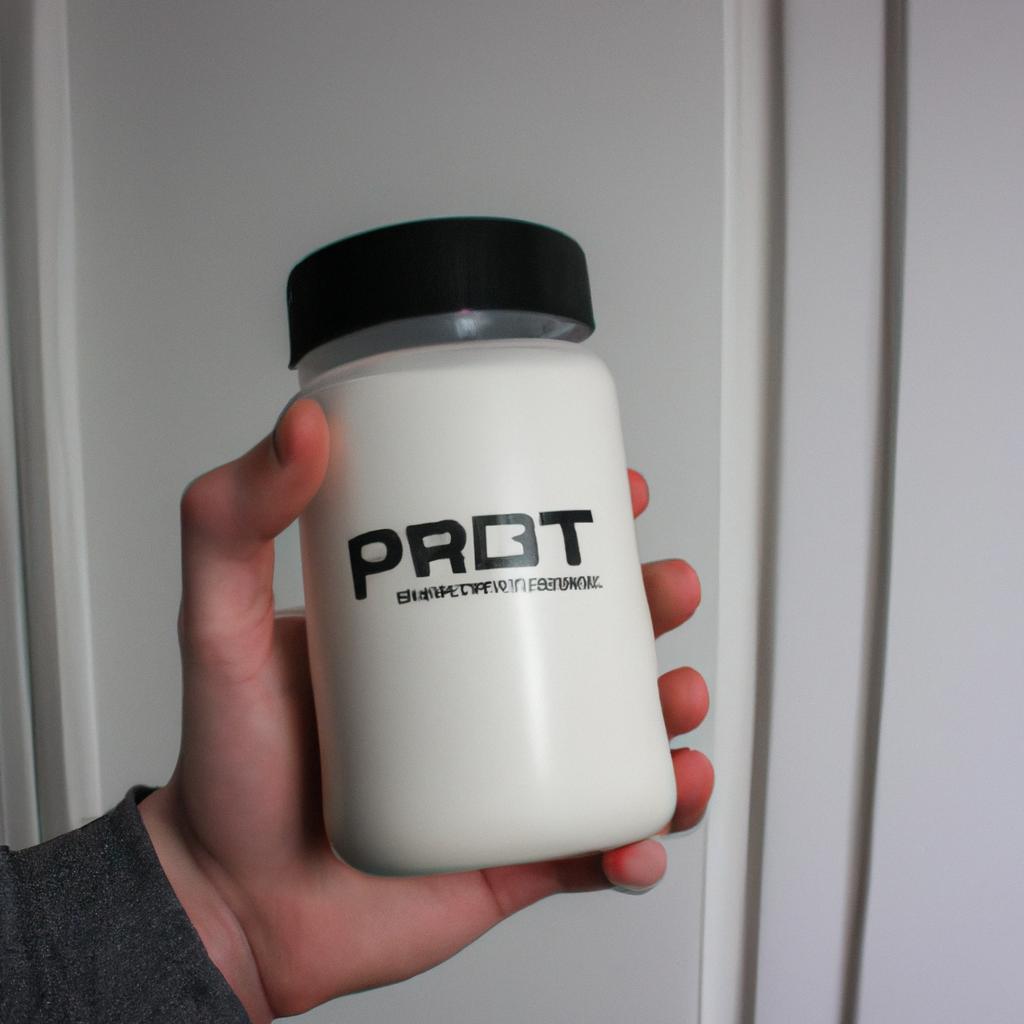 Person holding protein powder container
